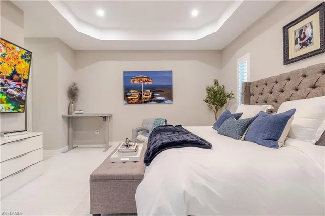 a bedroom with a bed and a couch