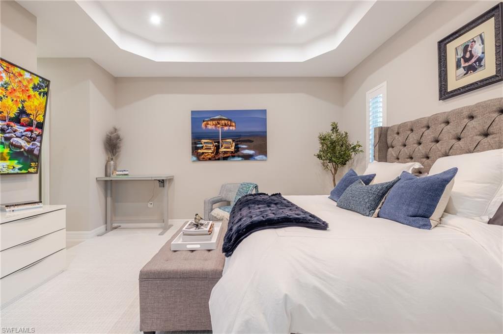 13543 Blue Bay Circle Fort Myers, FL 33913 - Photo 16 of 45 a bedroom with a bed and a couch