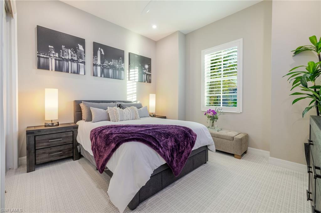 13543 Blue Bay Circle Fort Myers, FL 33913 - Photo 21 of 45 a bedroom with a bed dresser and a window