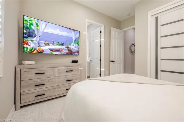 a bedroom with a bed and a dresser