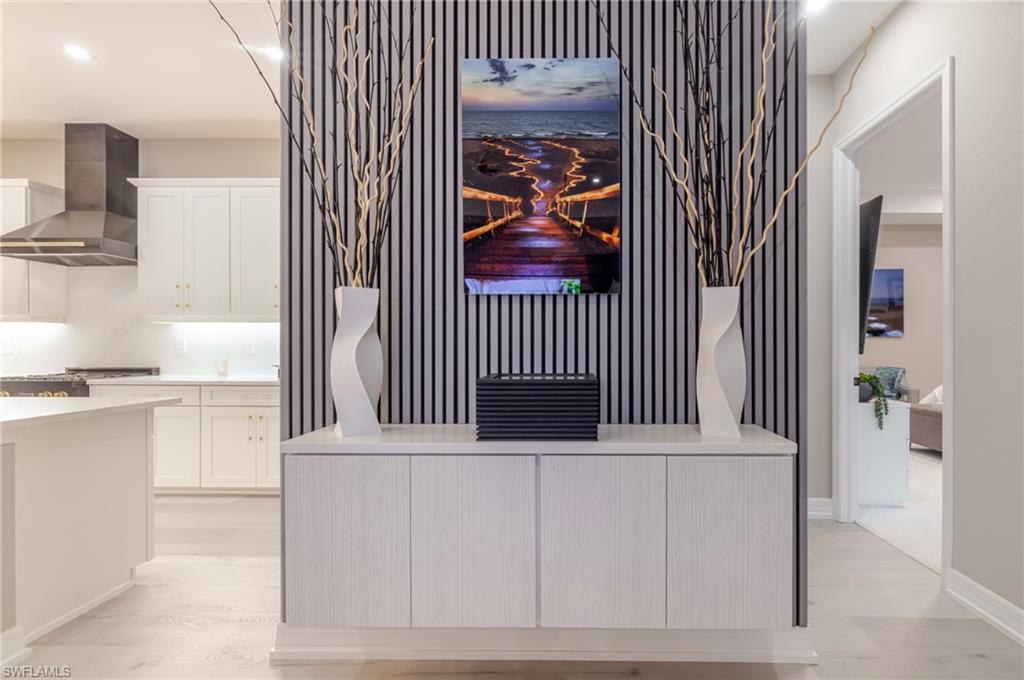 13543 Blue Bay Circle Fort Myers, FL 33913 - Photo 10 of 45 a view of a bedroom with wooden floor and a ceiling fan