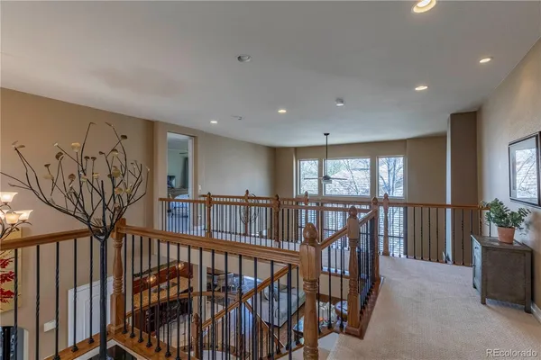a view of entryway with wooden floor and windows
