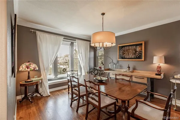 a view of a dining room with furniture window and wooden floor