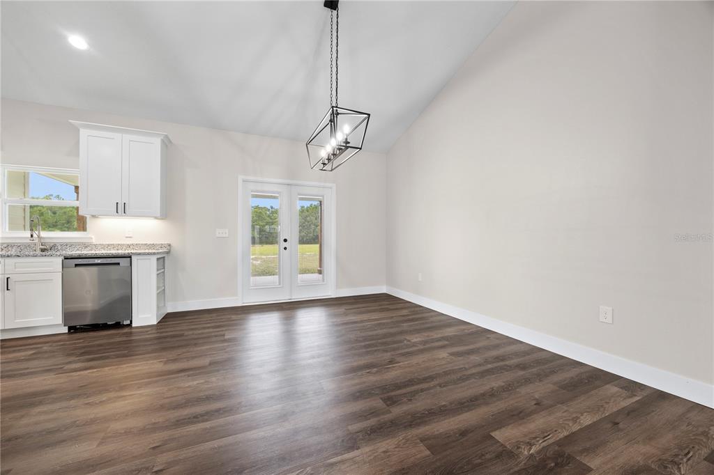 151 Southwest Scott Place Lake City, FL 32024 - Photo 15 of 47 a view of an empty room with a window and wooden floor