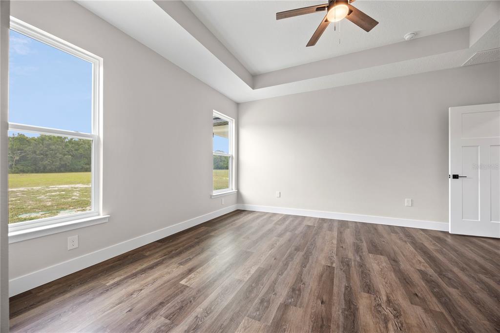 151 Southwest Scott Place Lake City, FL 32024 - Photo 17 of 47 wooden floor in an empty room with a window