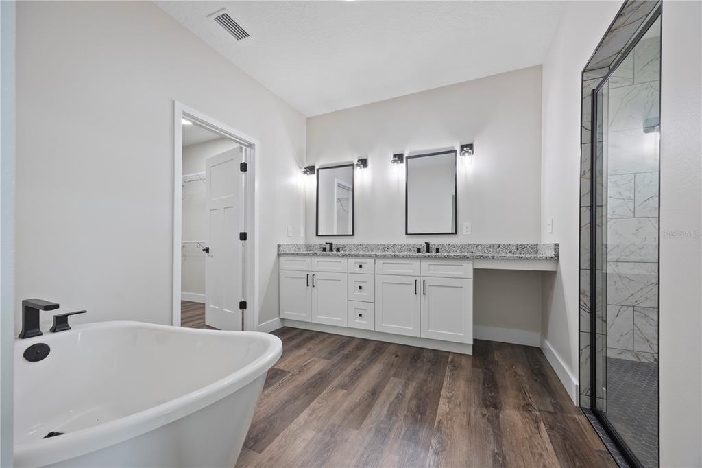 151 Southwest Scott Place Lake City, FL 32024 - Photo 18 of 47 a bathroom with a tub sink and mirror