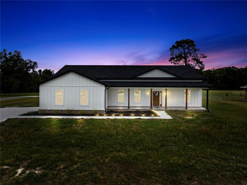 151 Southwest Scott Place Lake City, FL 32024 - Photo 2 of 47 a front view of a house with a garden and yard