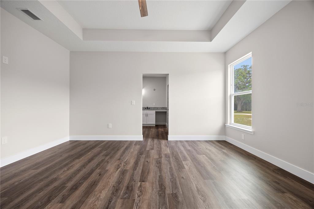 151 Southwest Scott Place Lake City, FL 32024 - Photo 31 of 47 wooden floor in an empty room with a window