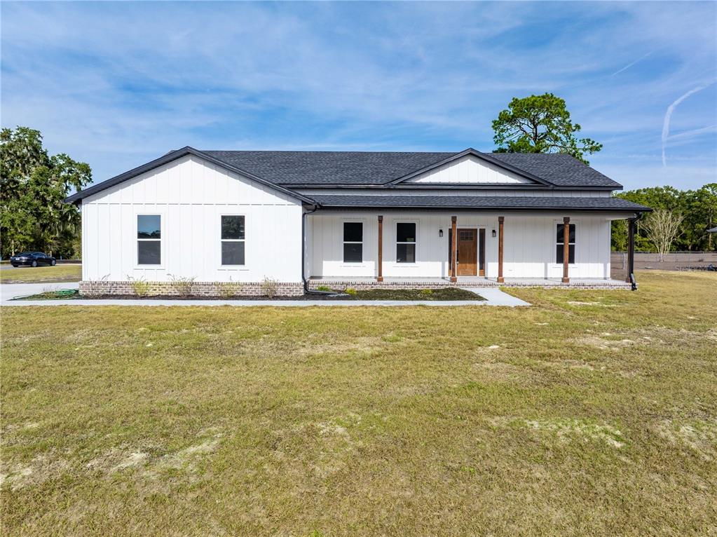 151 Southwest Scott Place Lake City, FL 32024 - Photo 34 of 47 a front view of a house with garden
