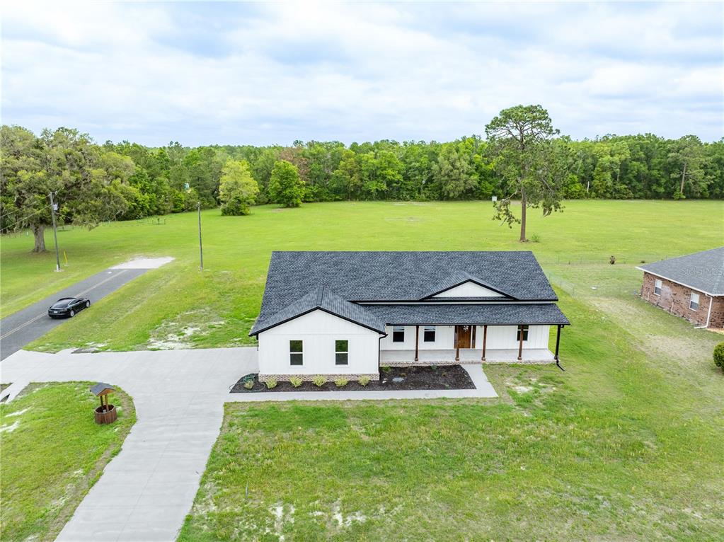 151 Southwest Scott Place Lake City, FL 32024 - Photo 41 of 47 a aerial view of a house with swimming pool and a yard