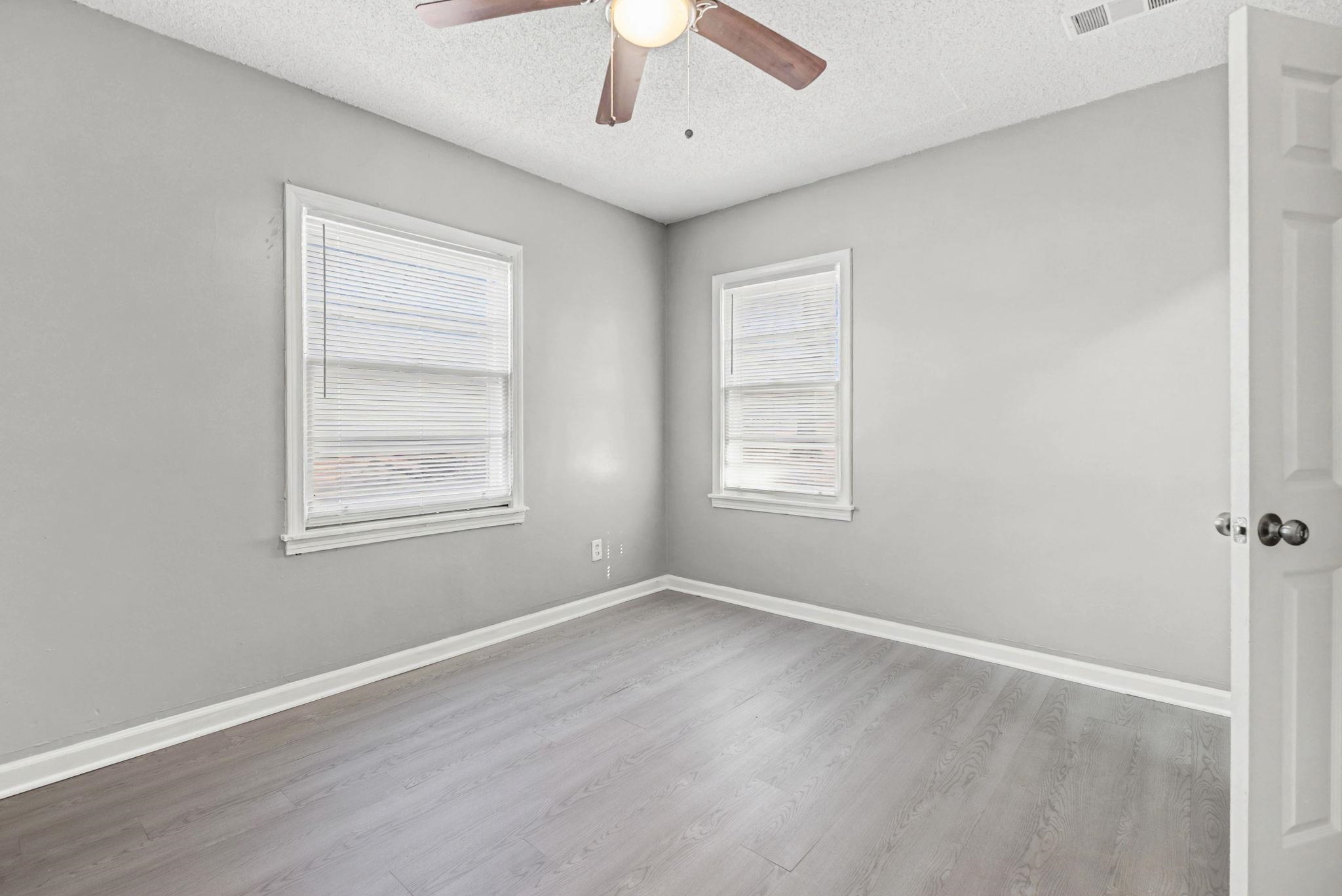 6733 Navy Road Millington, TN 38053 - Photo 5 of 25 wooden floor in an empty room with a window