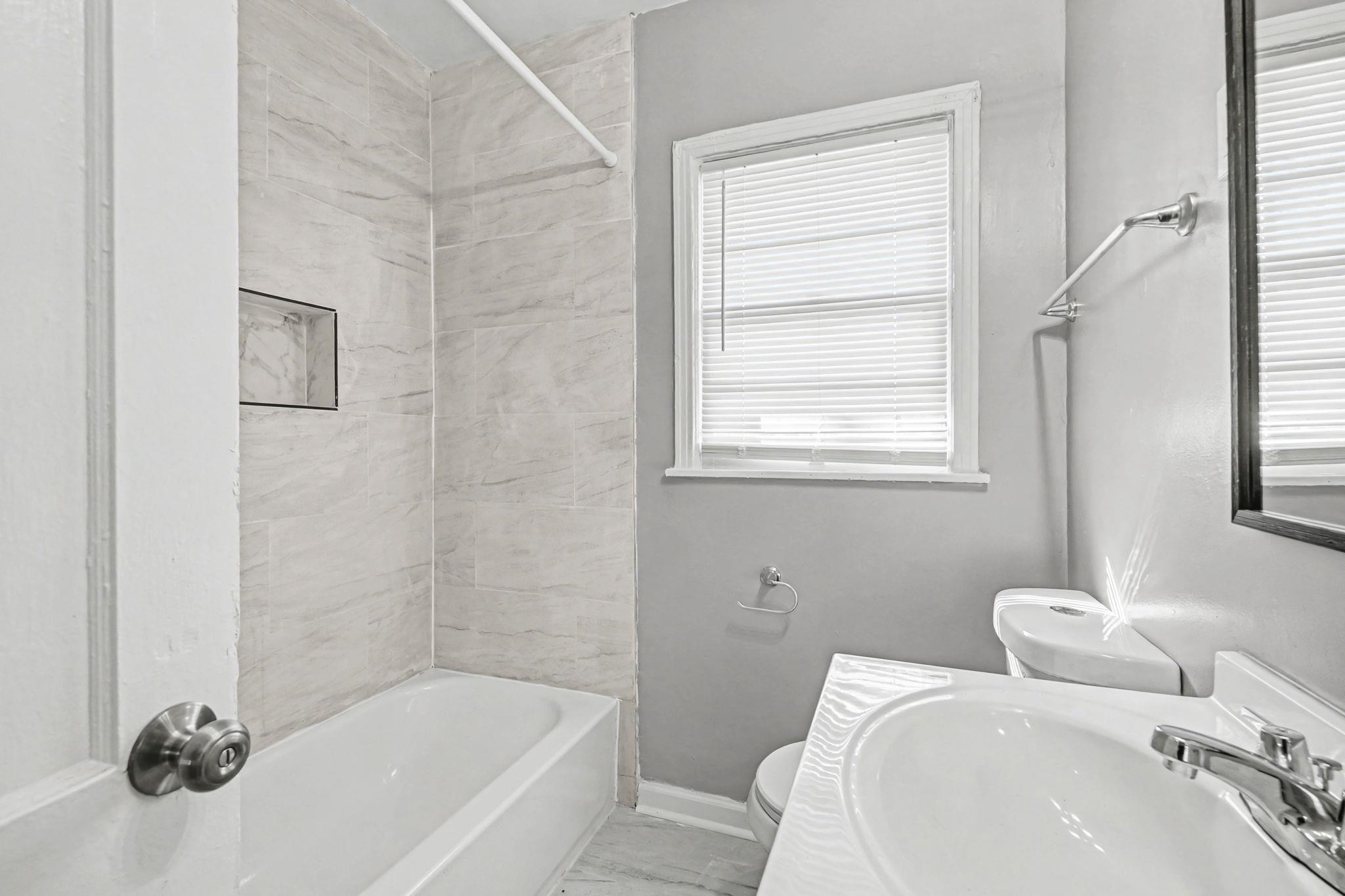 6733 Navy Road Millington, TN 38053 - Photo 7 of 25 a bathroom with a bathtub and shower