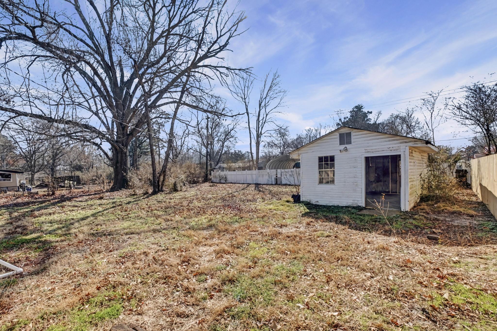 6733 Navy Road Millington, TN 38053 - Photo 9 of 25 a view of a house with a yard covered in snow