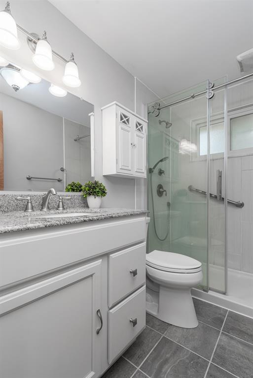 6130 Orchard Lane Butler, PA 16002 - Photo 20 of 24 a bathroom with a granite countertop sink toilet and shower