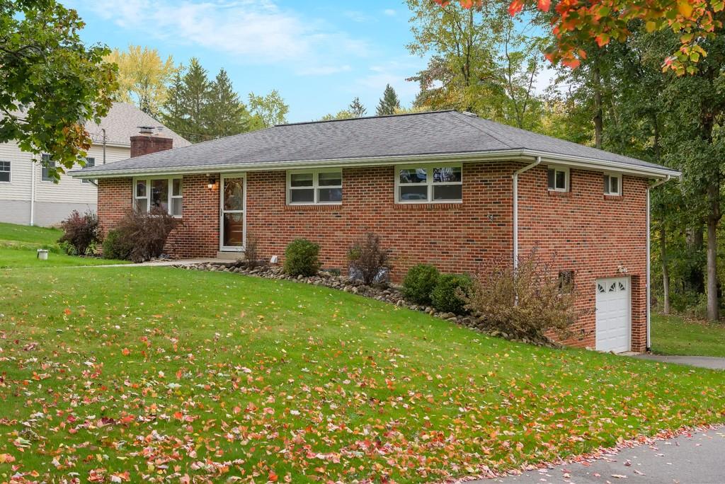 6130 Orchard Lane Butler, PA 16002 - Photo 2 of 24 a front view of a house with garden