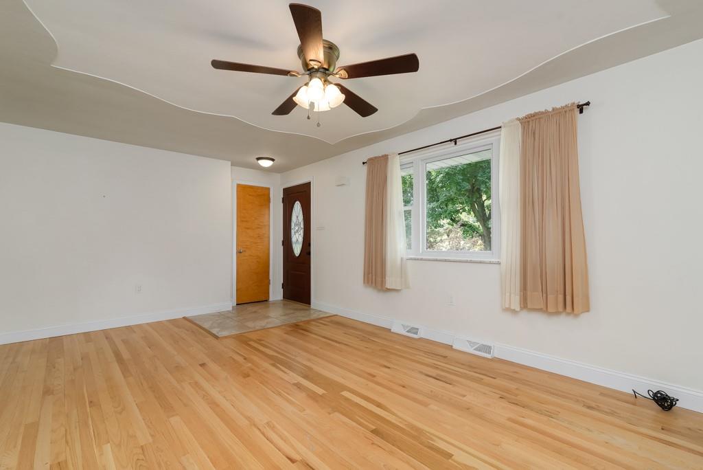 6130 Orchard Lane Butler, PA 16002 - Photo 4 of 24 a view of empty room with wooden floor and fan