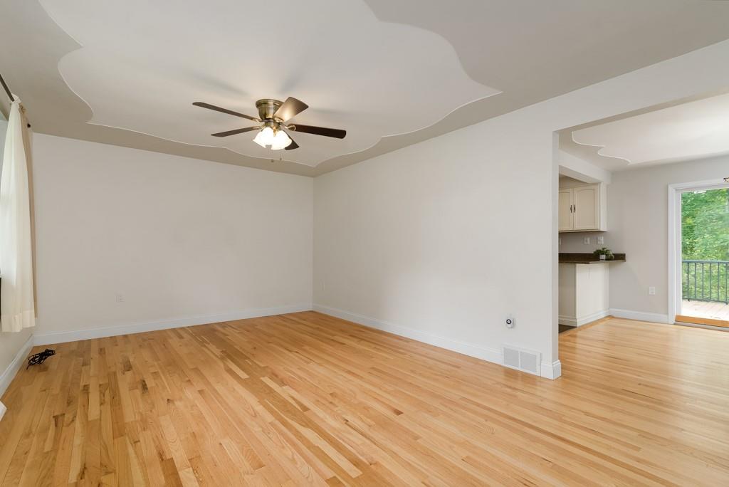 6130 Orchard Lane Butler, PA 16002 - Photo 6 of 24 a view of empty room with wooden floor and fan
