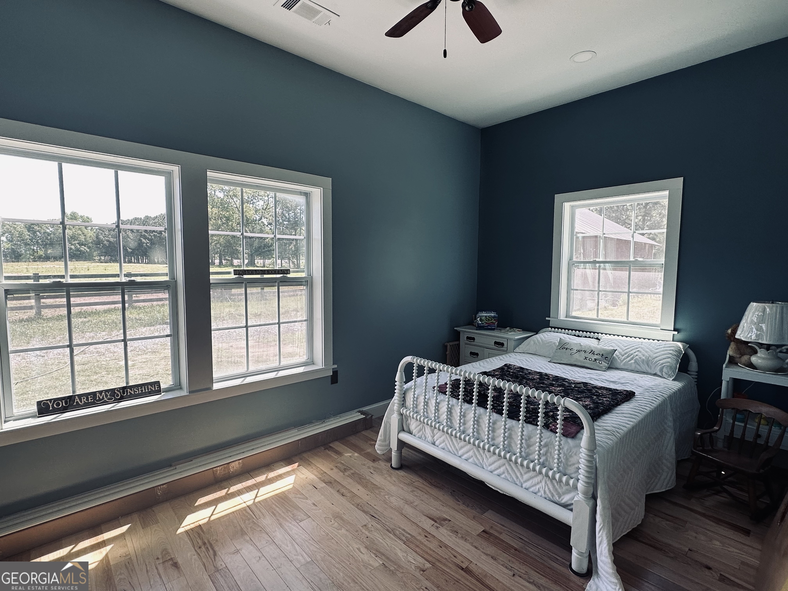 213 Fredonia Church Road Barnesville, GA 30204 - Photo 20 of 32 a bed sitting in a bedroom next to a window