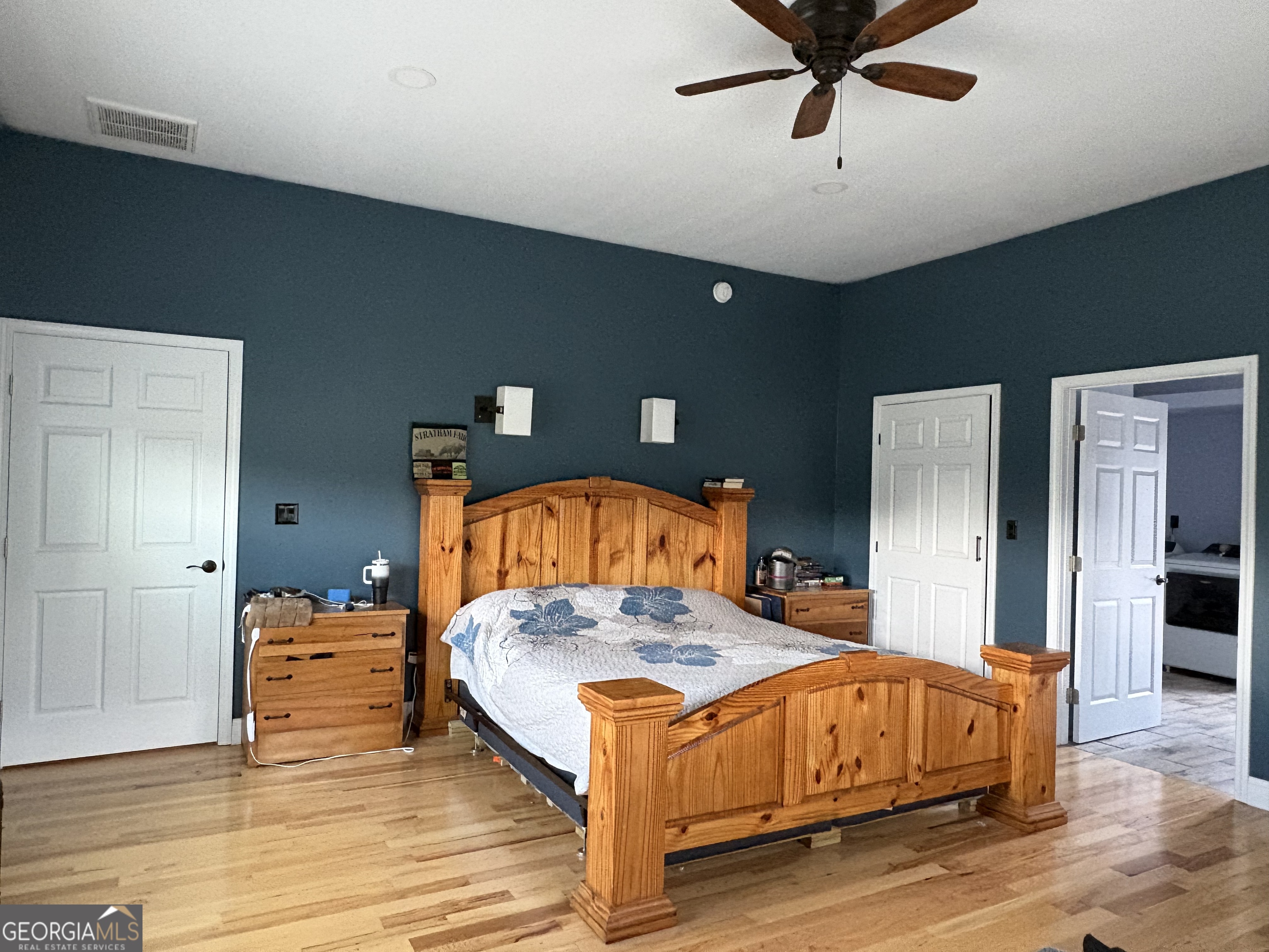 213 Fredonia Church Road Barnesville, GA 30204 - Photo 29 of 32 a bedroom with a bed and wooden floor