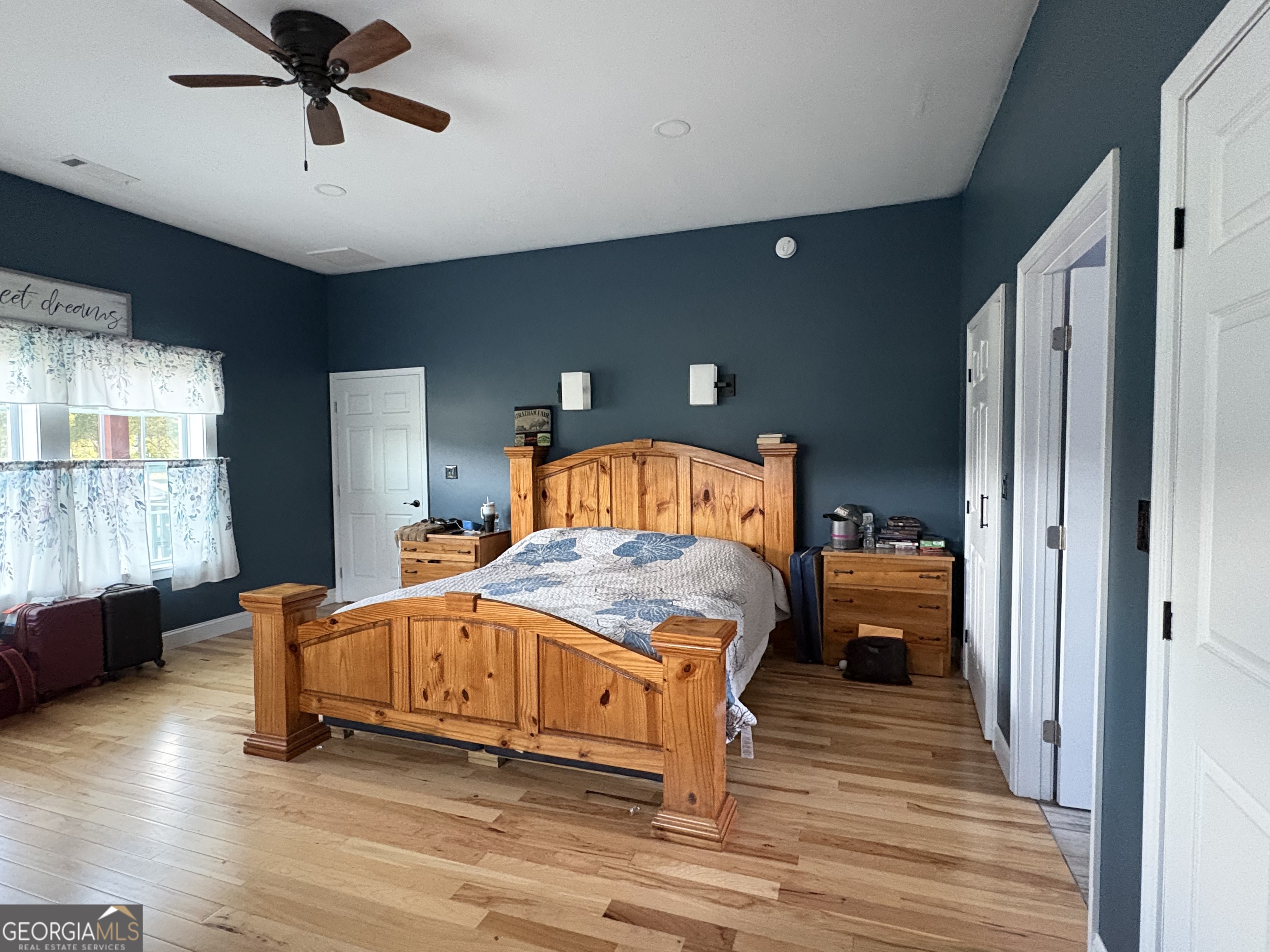 213 Fredonia Church Road Barnesville, GA 30204 - Photo 30 of 32 a bedroom with a bed and wooden floor