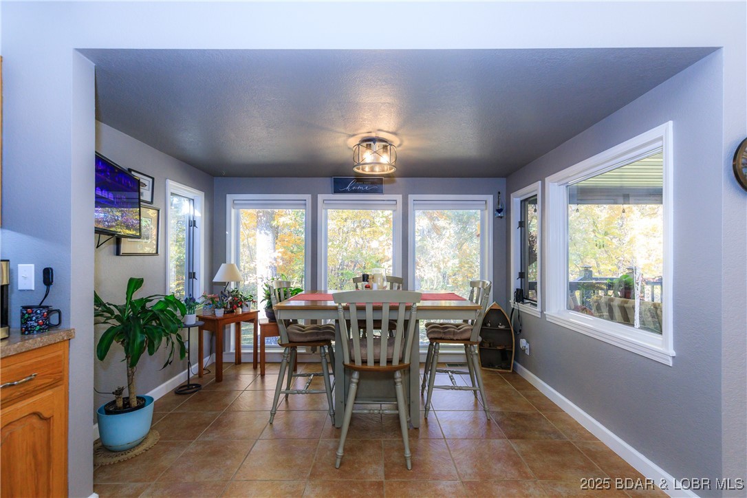 23 Leisure Road Eldon, MO 65026 - Photo 4 of 58 Additional breakfast nook with floor to ceiling wi