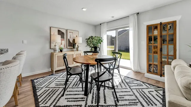 a kitchen with sink stove and refrigerator