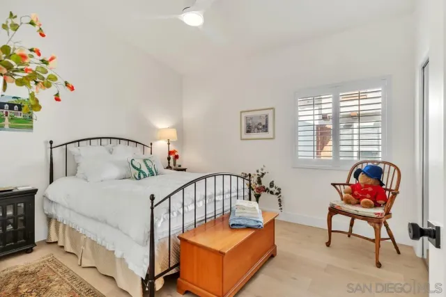 a bedroom with furniture and a window