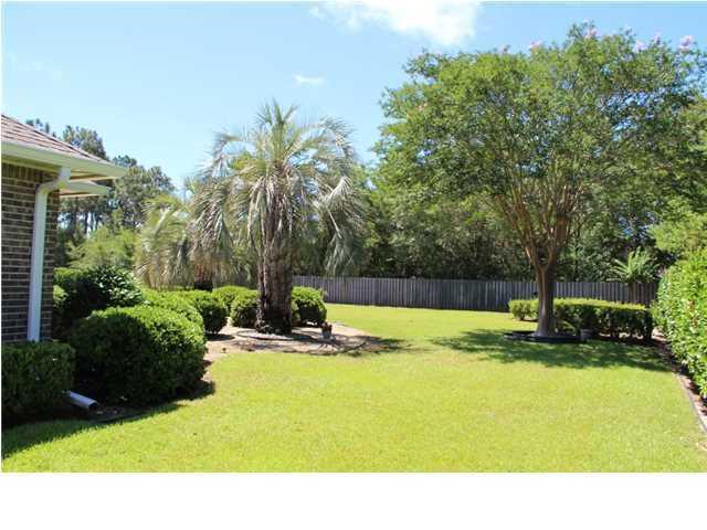 2557 Crescent Road Navarre, FL 32566 - Photo 11 of 48 a view of swimming pool with a garden