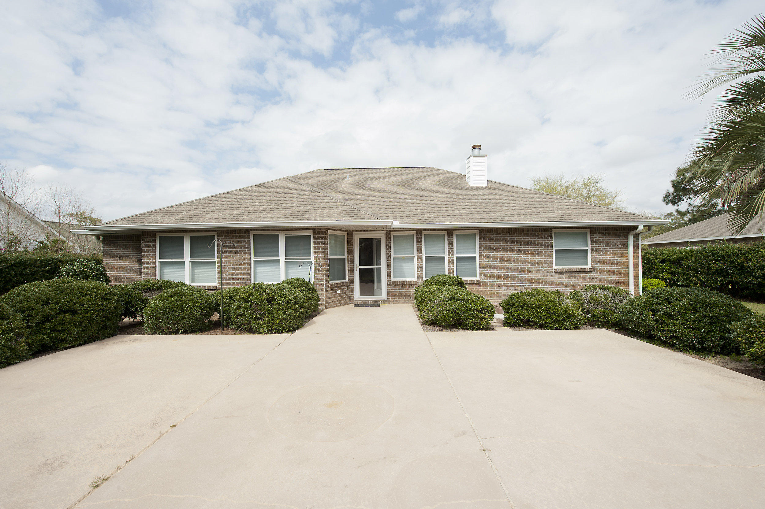 2557 Crescent Road Navarre, FL 32566 - Photo 17 of 48 a front view of house with yard and green space