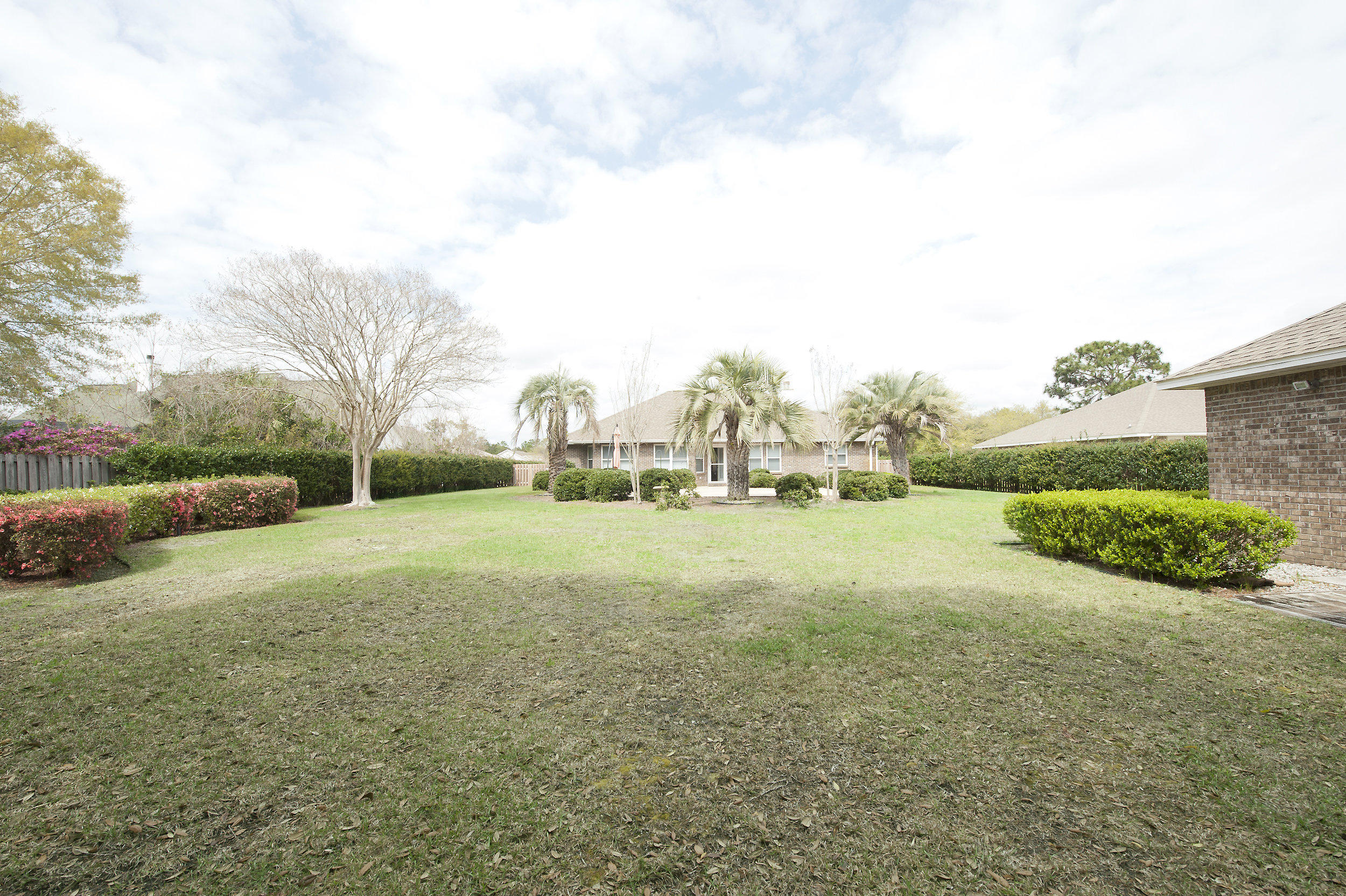 2557 Crescent Road Navarre, FL 32566 - Photo 19 of 48 a view of dirt field with large trees