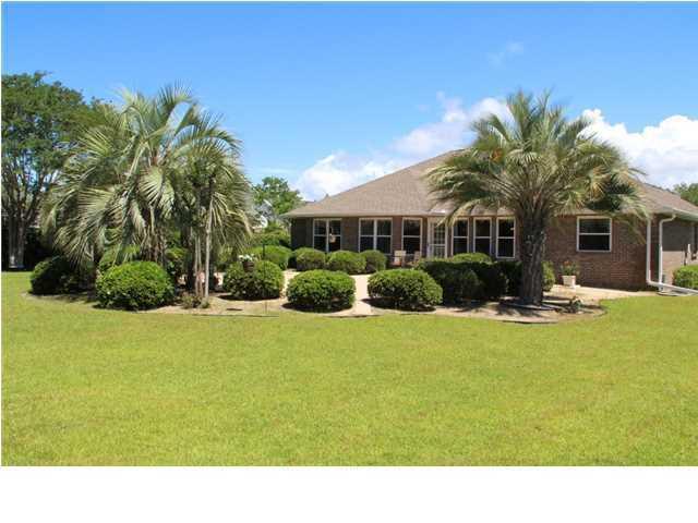 2557 Crescent Road Navarre, FL 32566 - Photo 3 of 48 a view of house with outdoor space and swimming pool