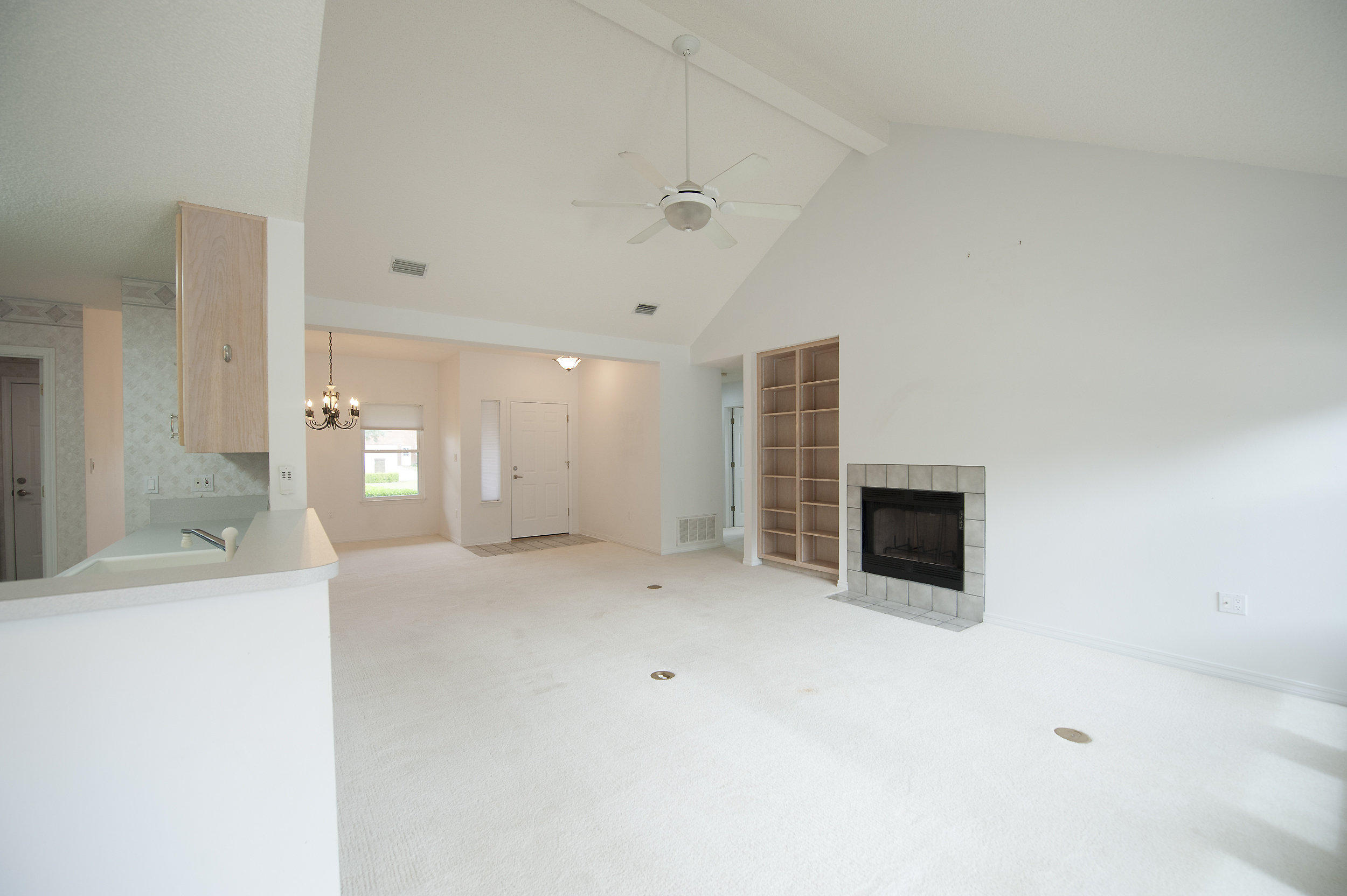 2557 Crescent Road Navarre, FL 32566 - Photo 38 of 48 a view of a kitchen with a sink and a fireplace