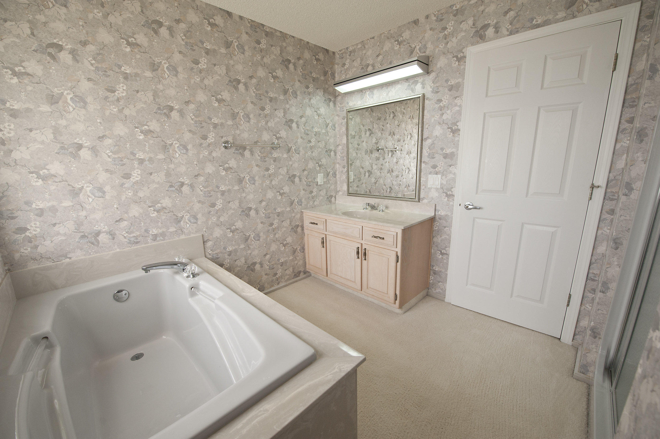 2557 Crescent Road Navarre, FL 32566 - Photo 47 of 48 a bathroom with a sink and a bathtub