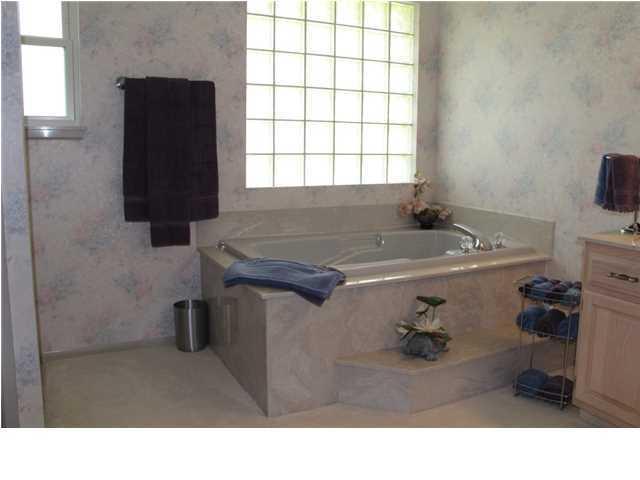 2557 Crescent Road Navarre, FL 32566 - Photo 6 of 48 a bathroom with a sink and a mirror