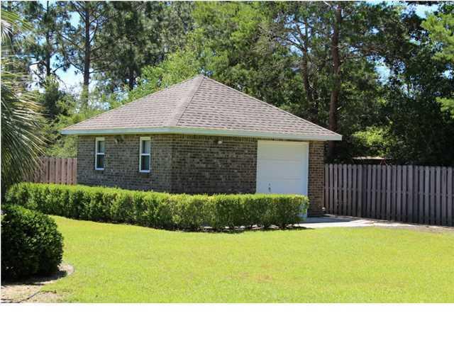 2557 Crescent Road Navarre, FL 32566 - Photo 8 of 48 a view of a backyard with a garden