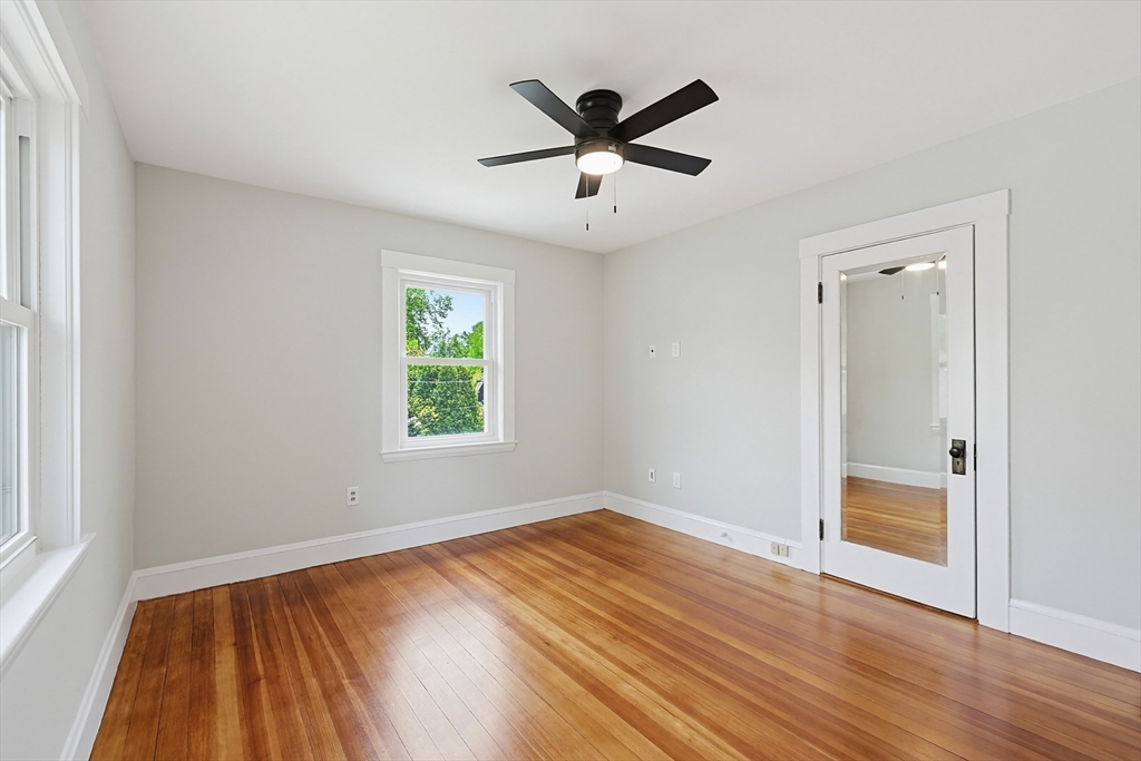10 Water Street Natick, MA 01760 - Photo 16 of 35 wooden floor in an empty room with a window