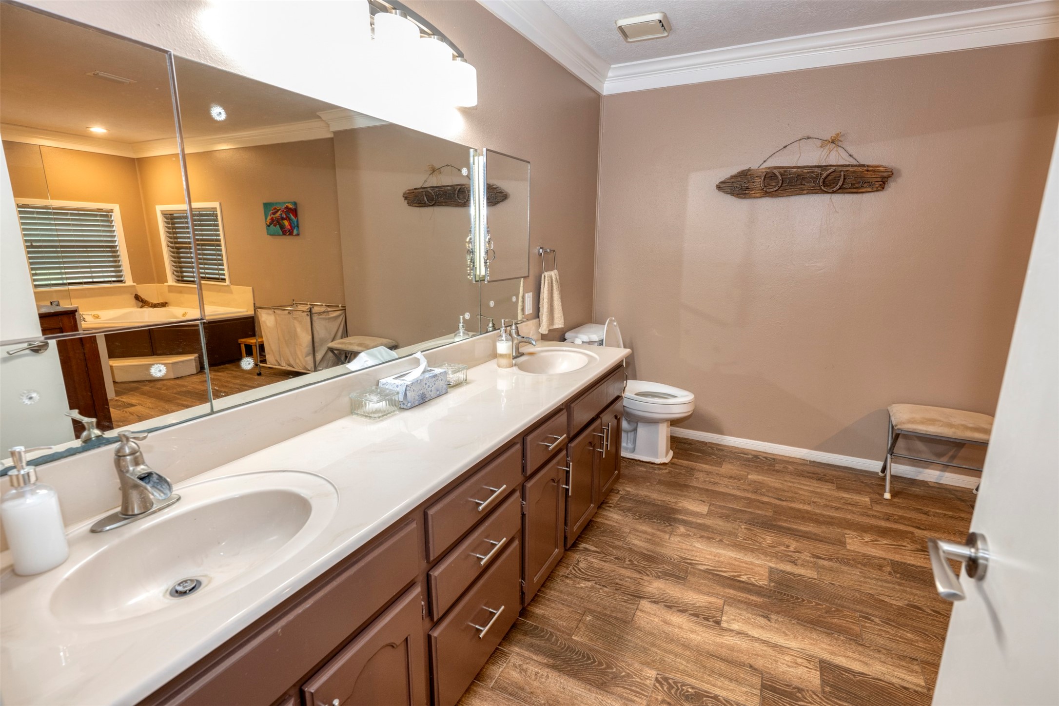 8775 Lone Star Road Washington, TX 77880 - Photo 17 of 44 a bathroom with a double vanity sink and a mirror