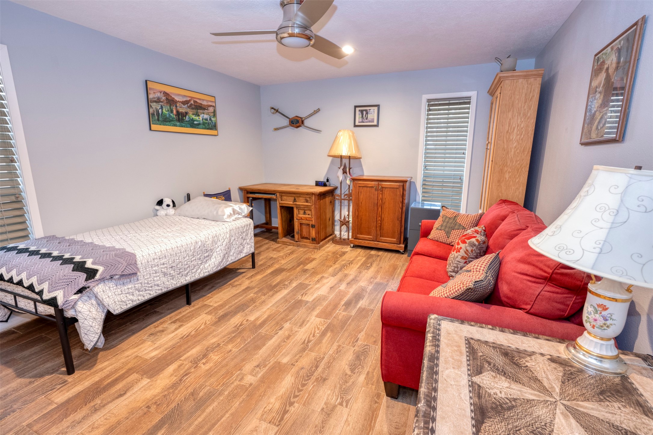 8775 Lone Star Road Washington, TX 77880 - Photo 18 of 44 a bedroom with a bed and wooden floor