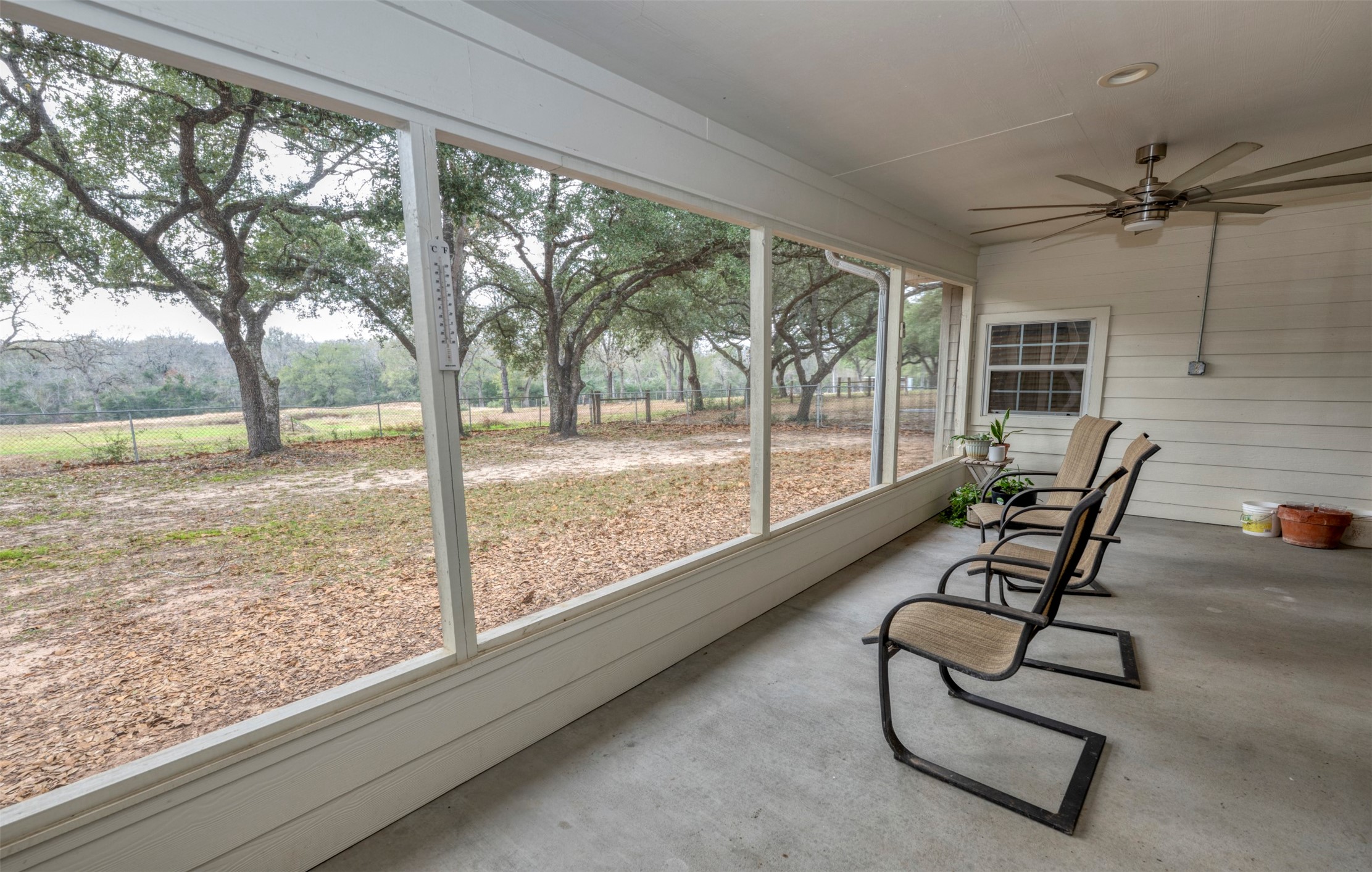 8775 Lone Star Road Washington, TX 77880 - Photo 21 of 44 a view of a floor to ceiling window and wooden floor