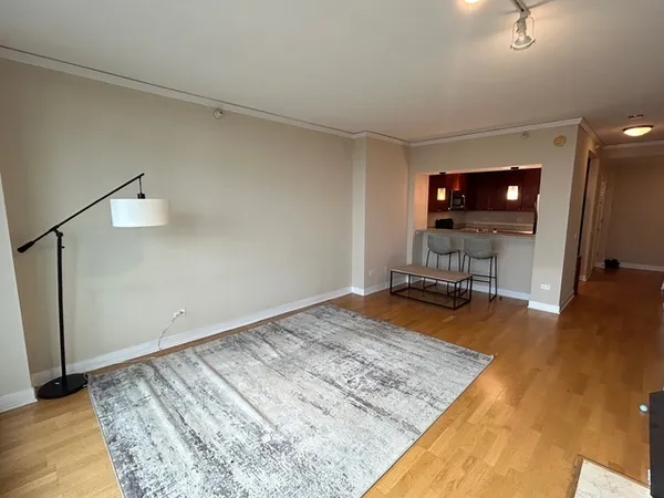 a view of a livingroom with workspace and a couch