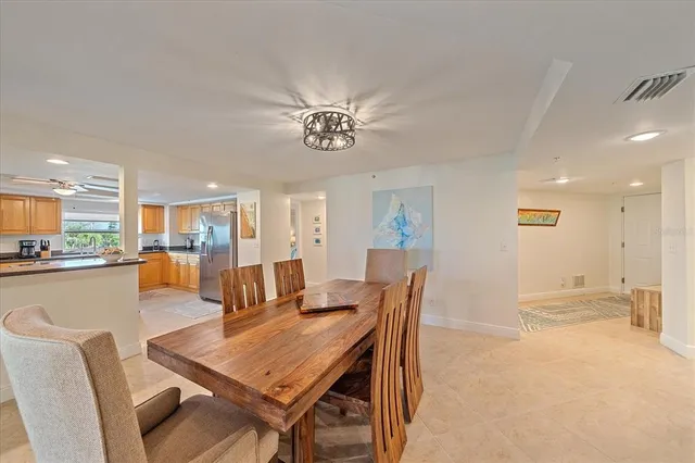 a bedroom with two beds and a chandelier