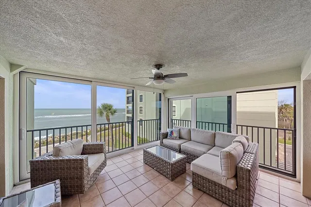 a living room with furniture a rug and a flat screen tv