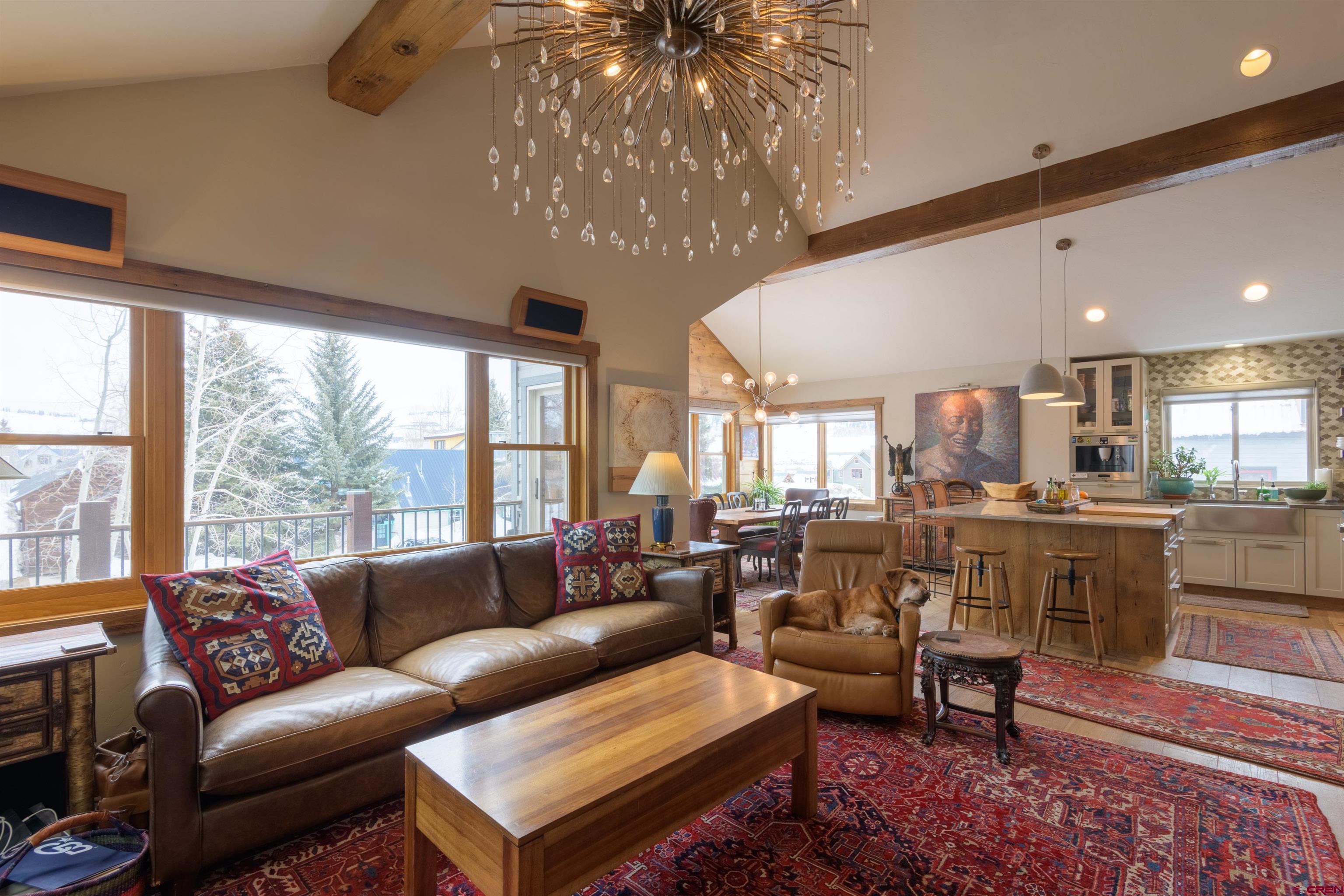 722 Elk Avenue Crested Butte, CO 81224 - Photo 14 of 32 a living room with furniture and a large window