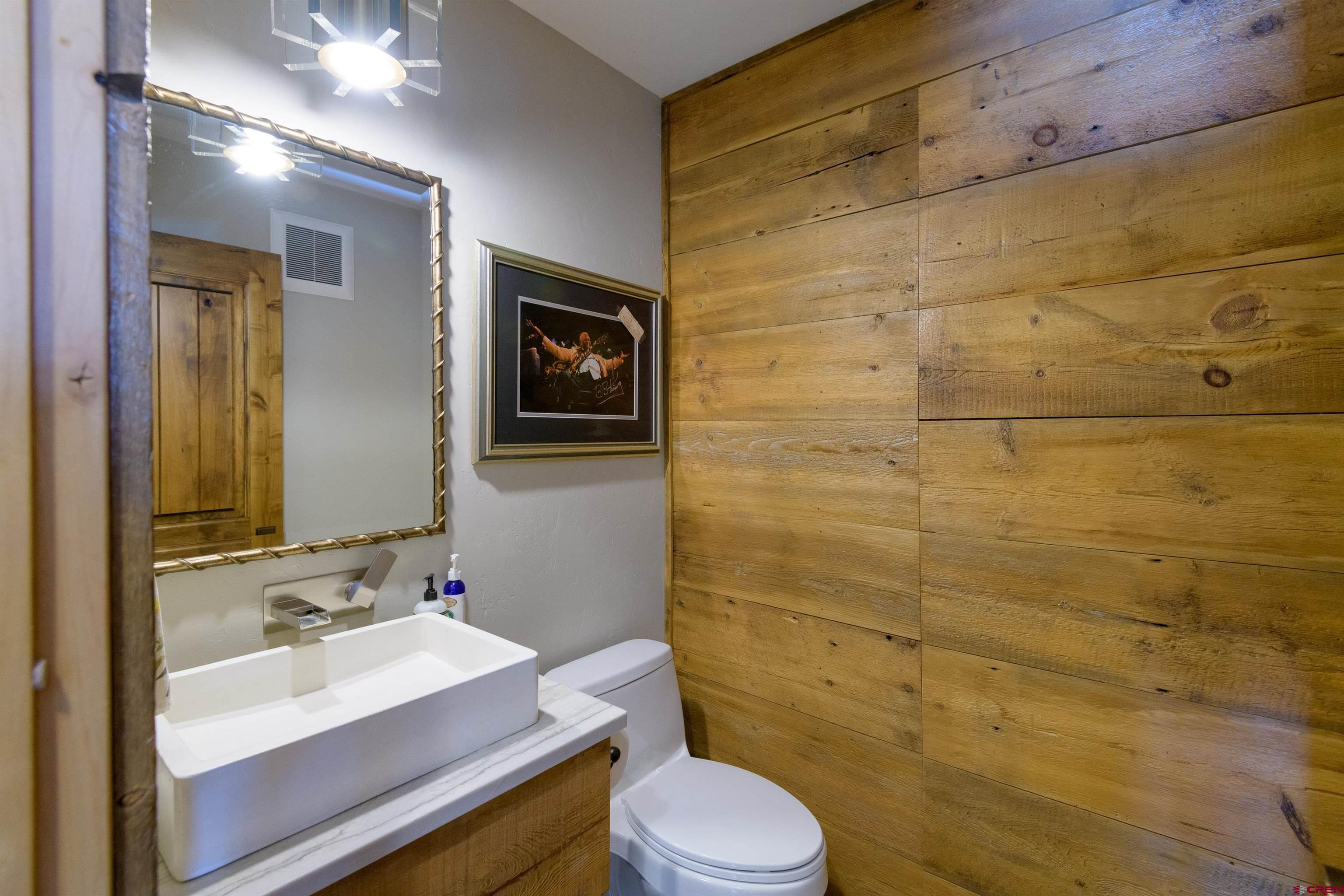 722 Elk Avenue Crested Butte, CO 81224 - Photo 18 of 32 a bathroom with a sink a toilet and shower