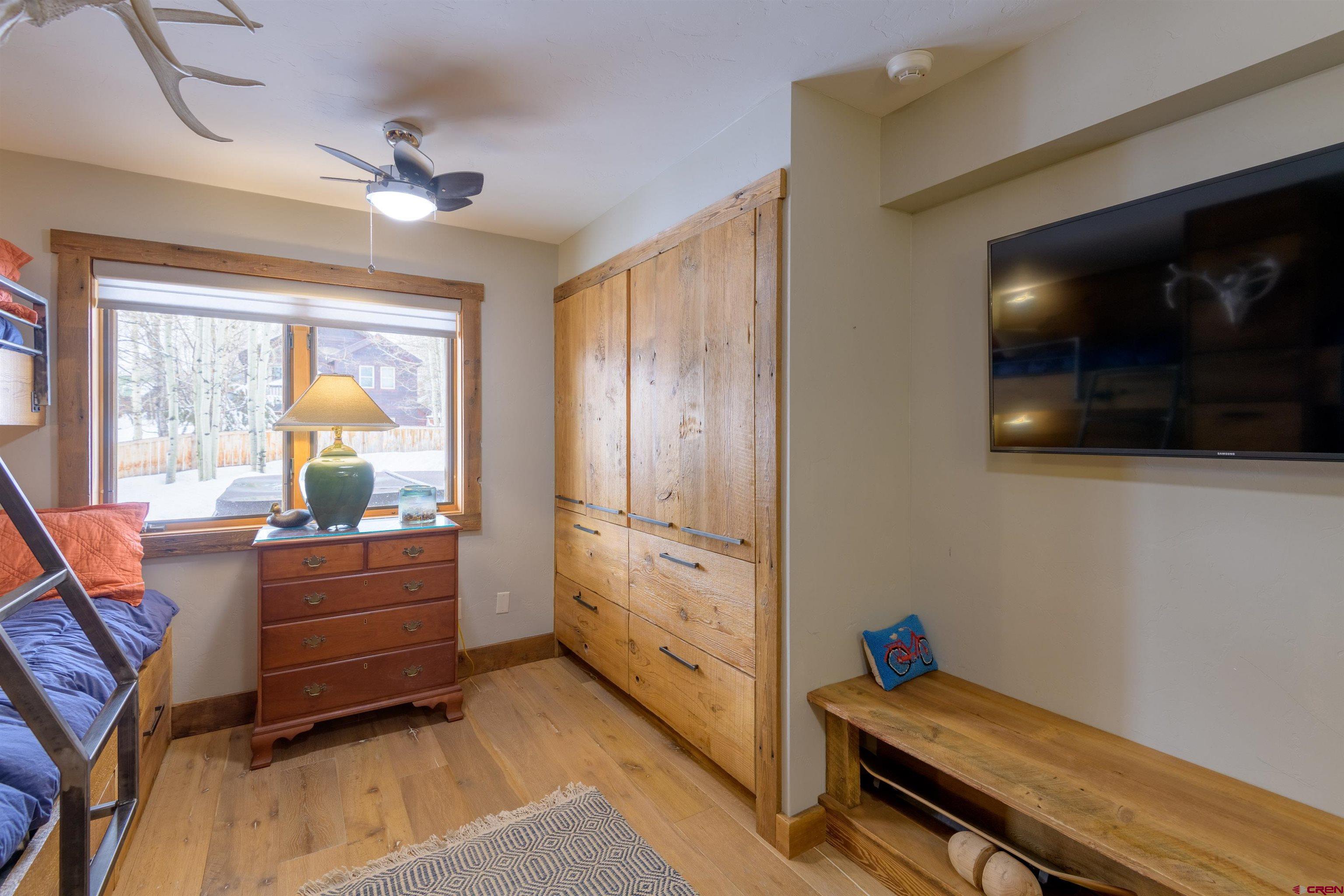 722 Elk Avenue Crested Butte, CO 81224 - Photo 23 of 32 a living room with furniture and a flat screen tv