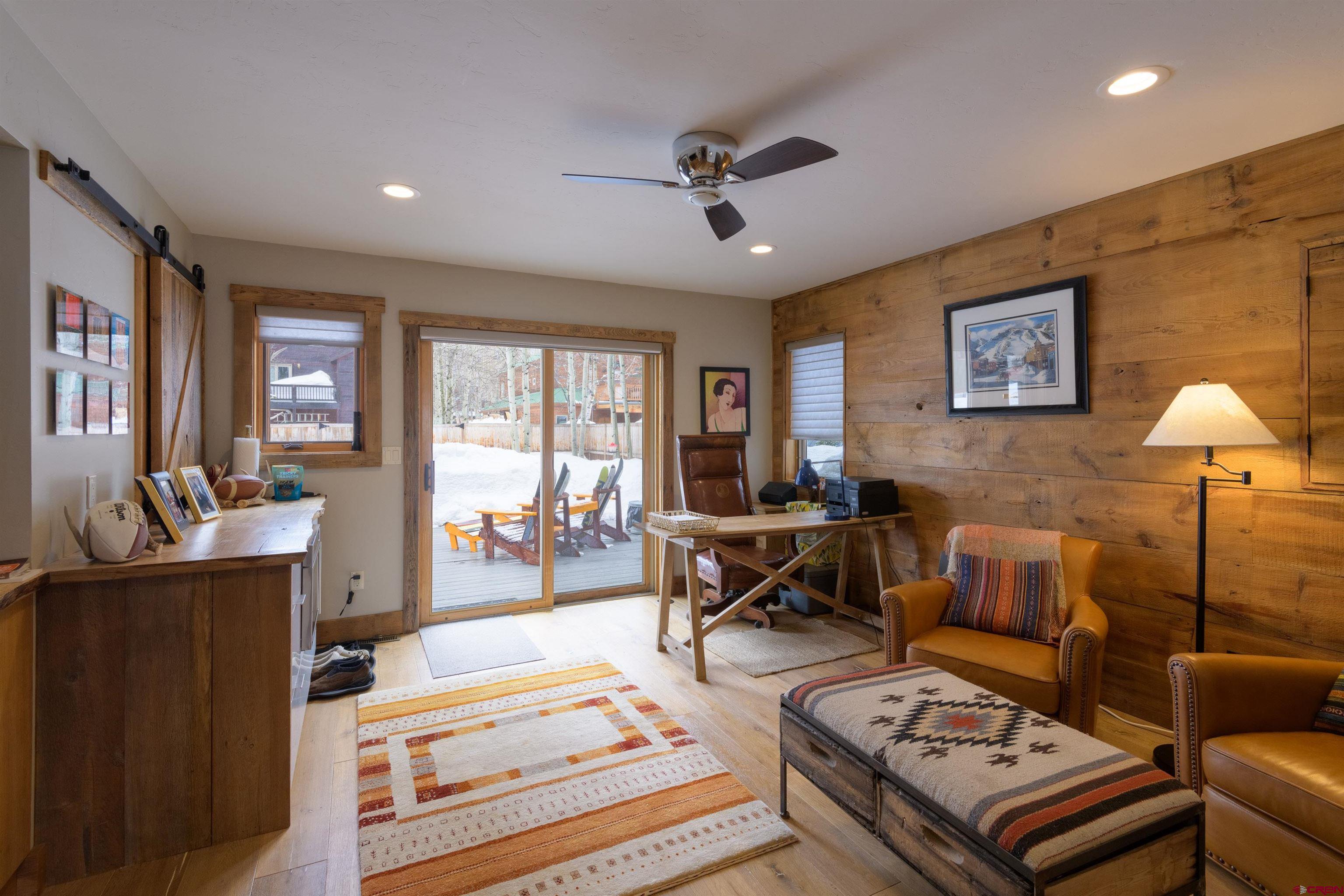 722 Elk Avenue Crested Butte, CO 81224 - Photo 25 of 32 a living room with furniture and a large window
