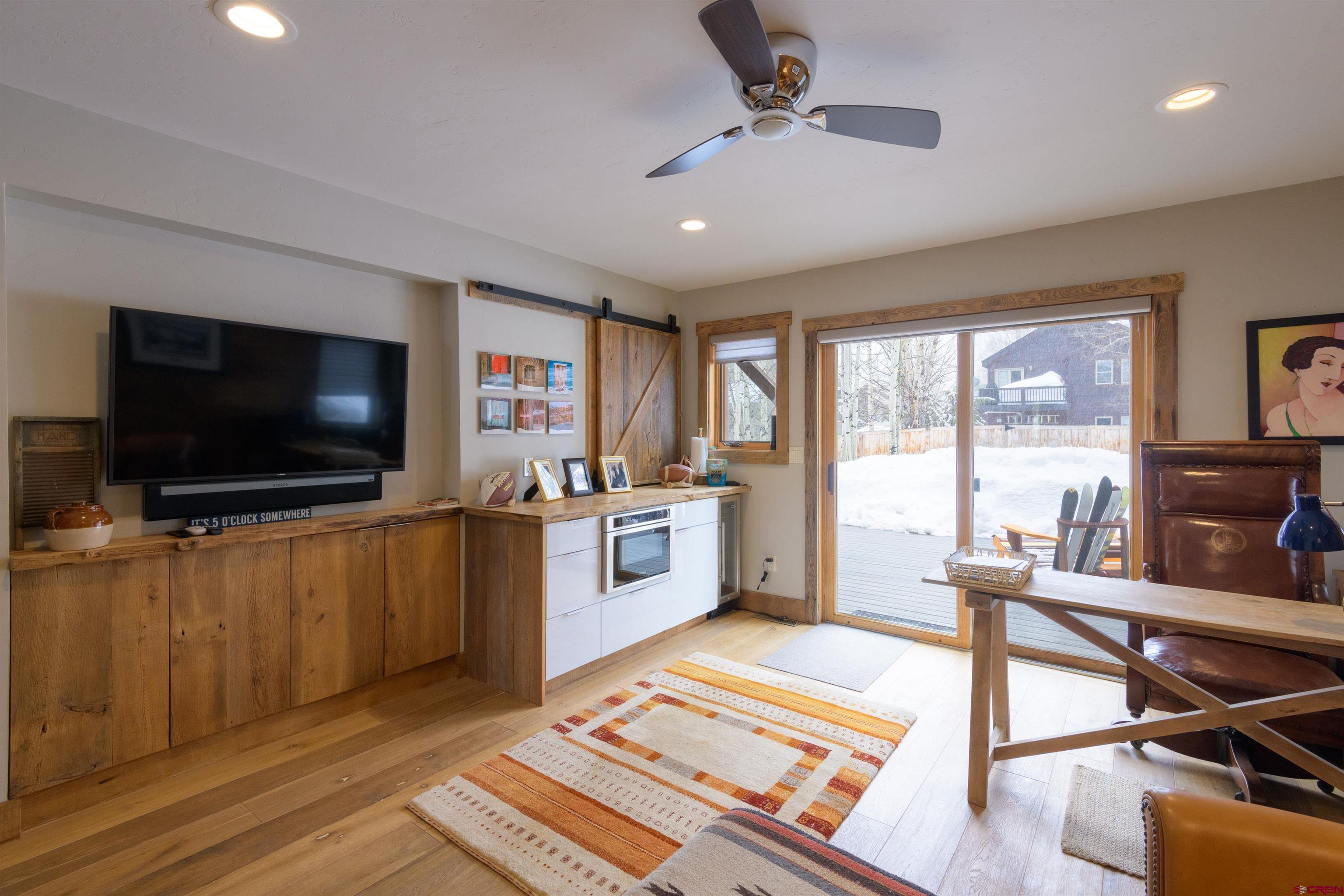 722 Elk Avenue Crested Butte, CO 81224 - Photo 26 of 32 a living room with furniture and a flat screen tv