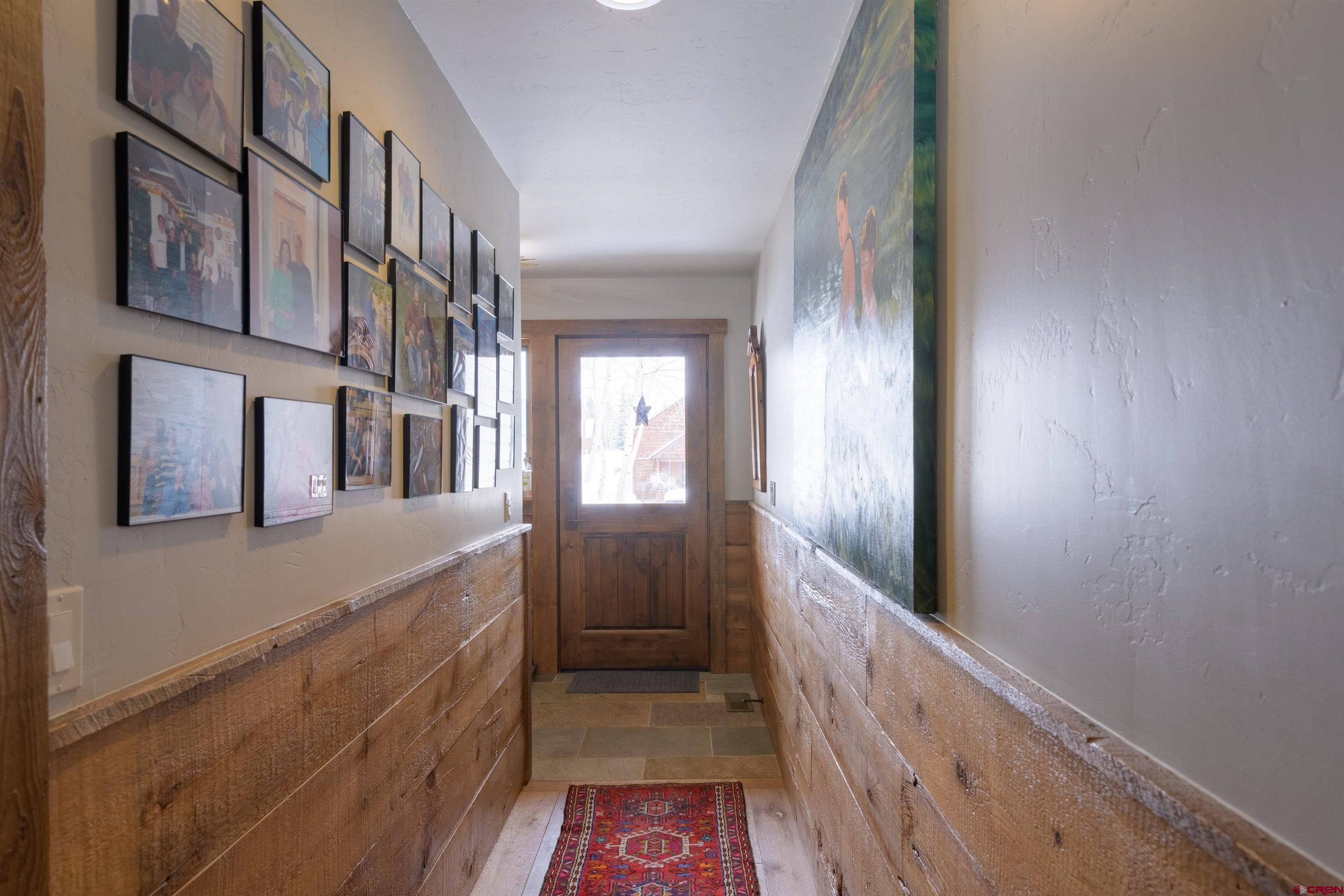 722 Elk Avenue Crested Butte, CO 81224 - Photo 27 of 32 a view of hallway with a large mirror
