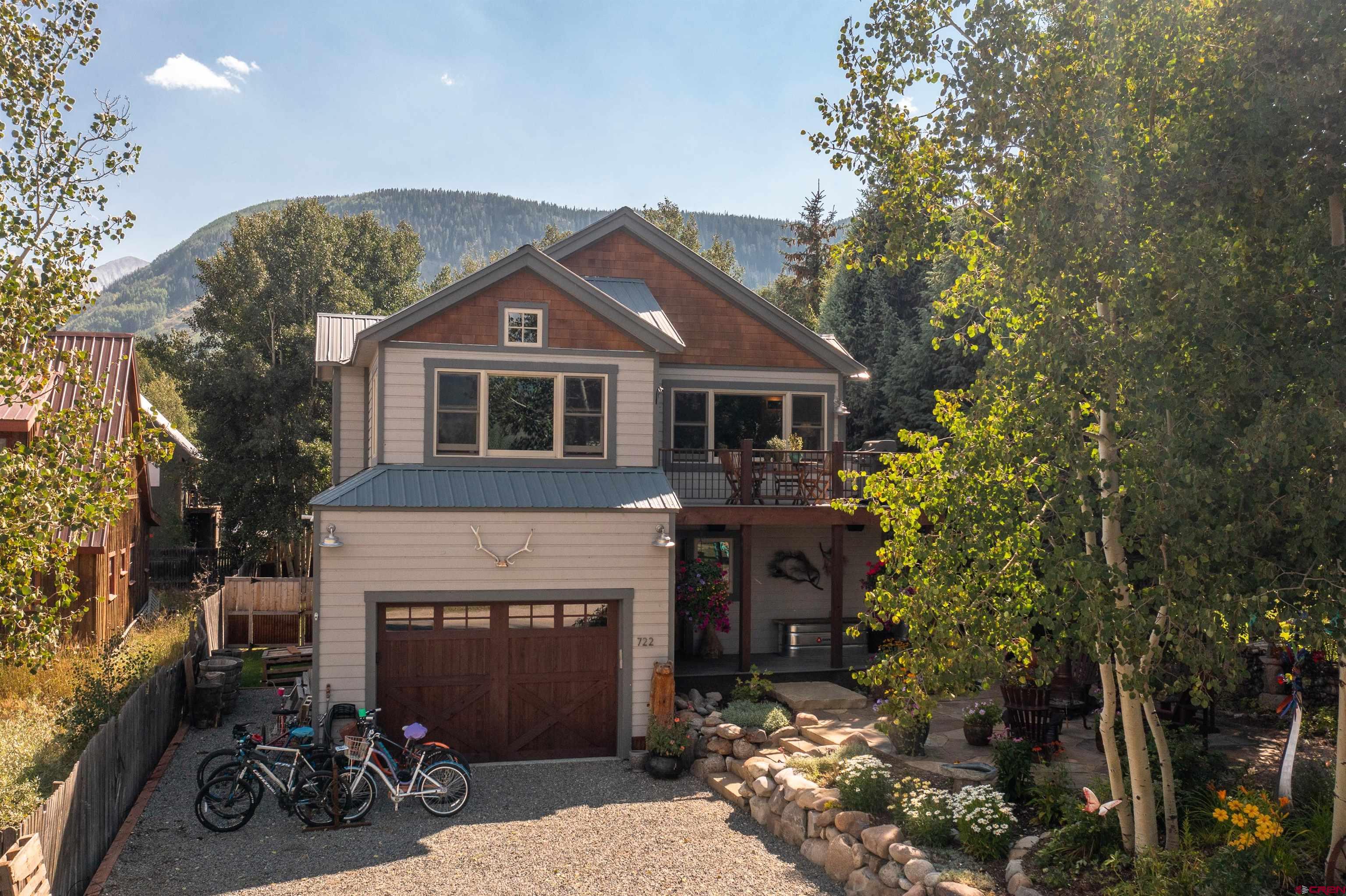 722 Elk Avenue Crested Butte, CO 81224 - Photo 29 of 32 a front view of a house with a yard