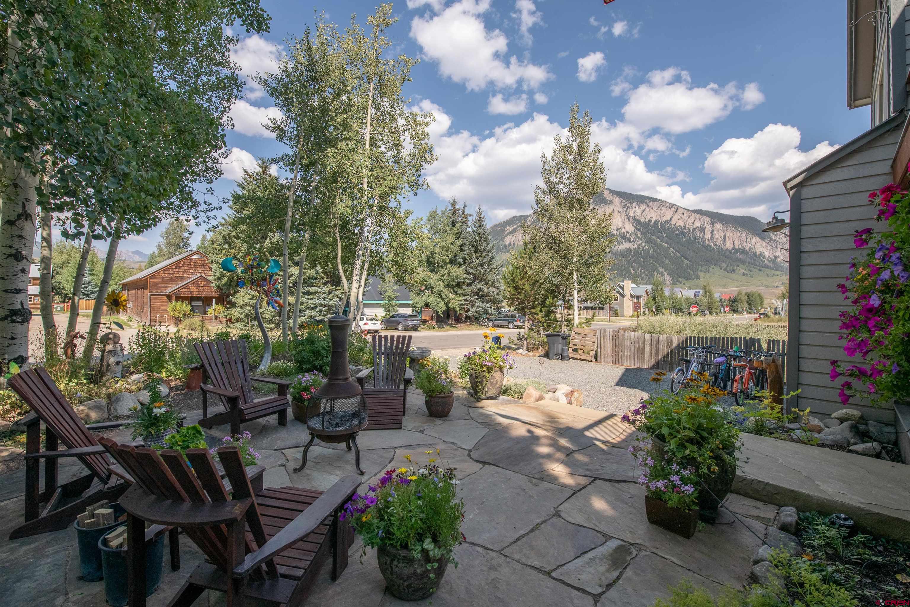 722 Elk Avenue Crested Butte, CO 81224 - Photo 4 of 32 a view of a chairs and tables in the patio